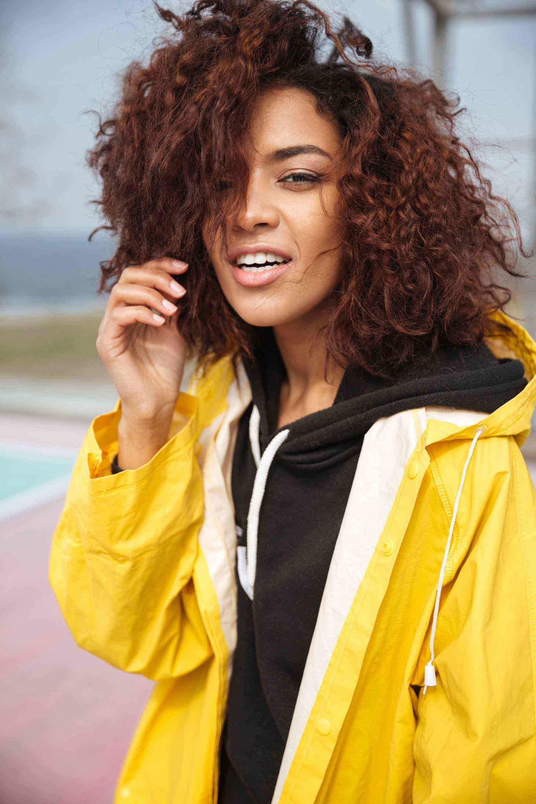 amazing-african-curly-young-woman-wearing-yellow-PCUMRSX-unsplash-1-scaled-e1582915738884.jpg